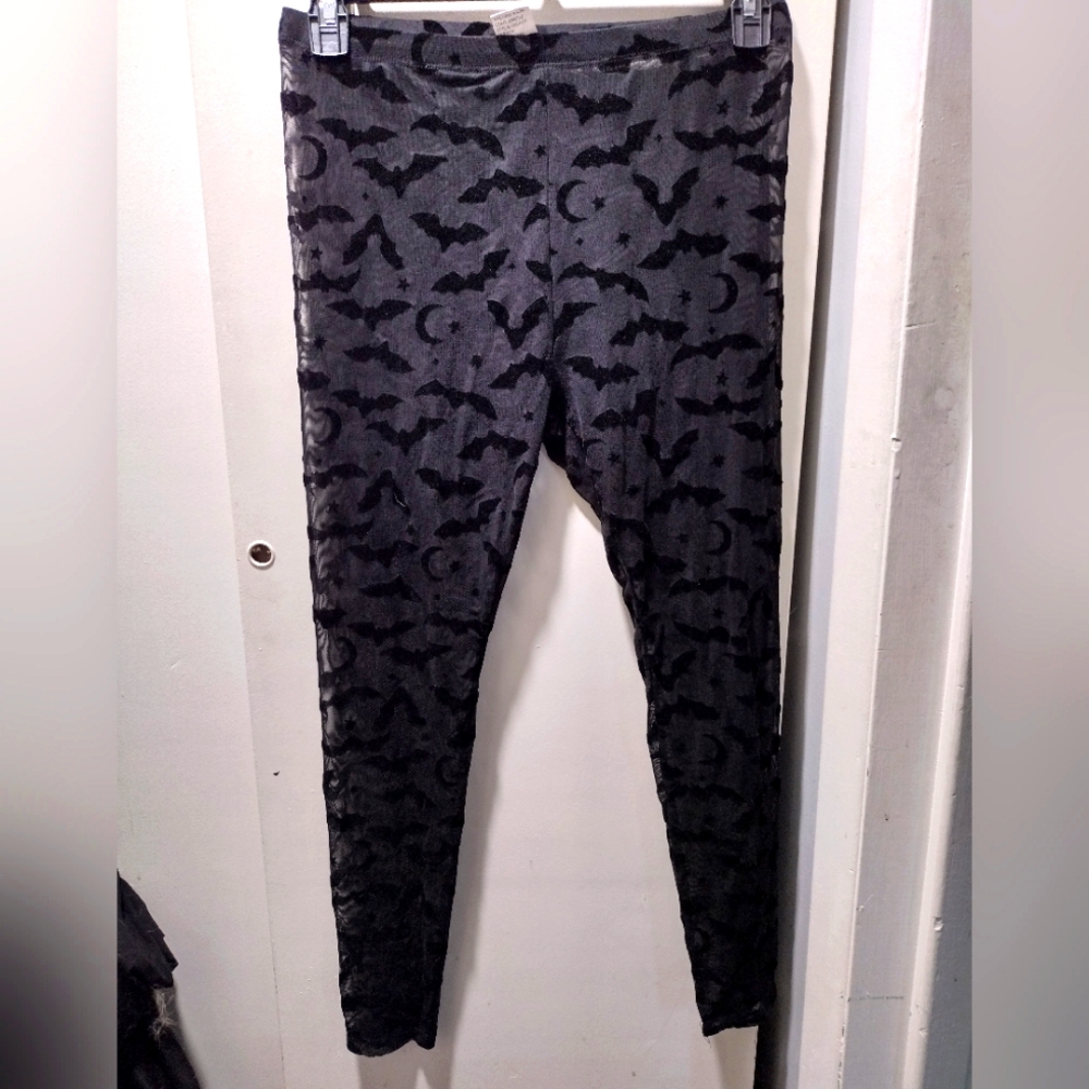 Sheer mesh bat goth leggings.